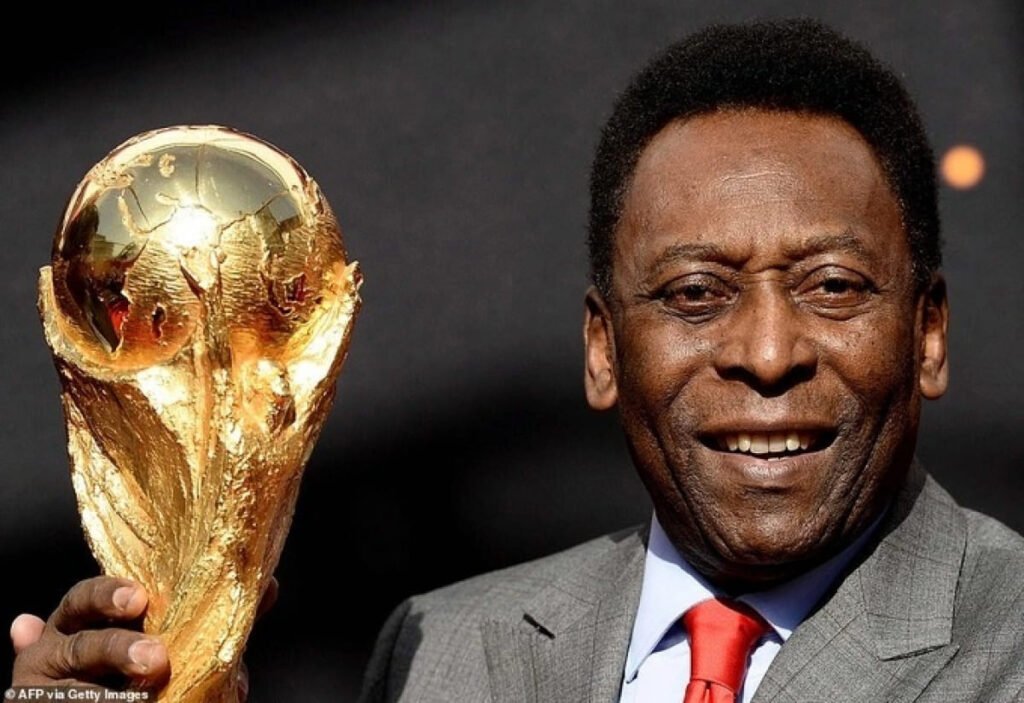 Pelé, the King of Football, lifting the World Cup trophy after leading Brazil to glory